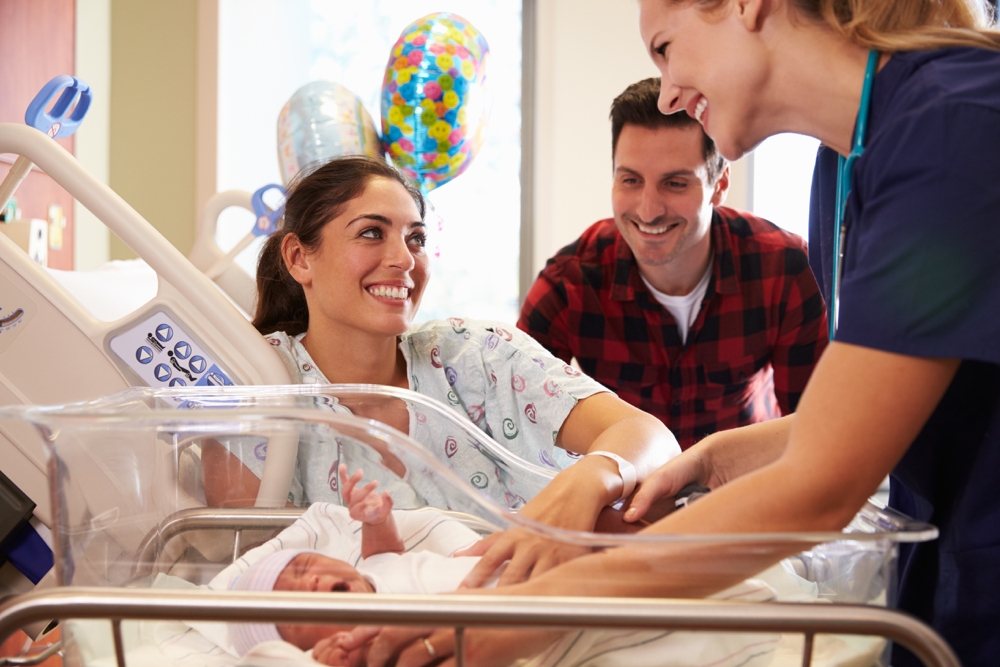 Nurse taking care of a new mother and baby