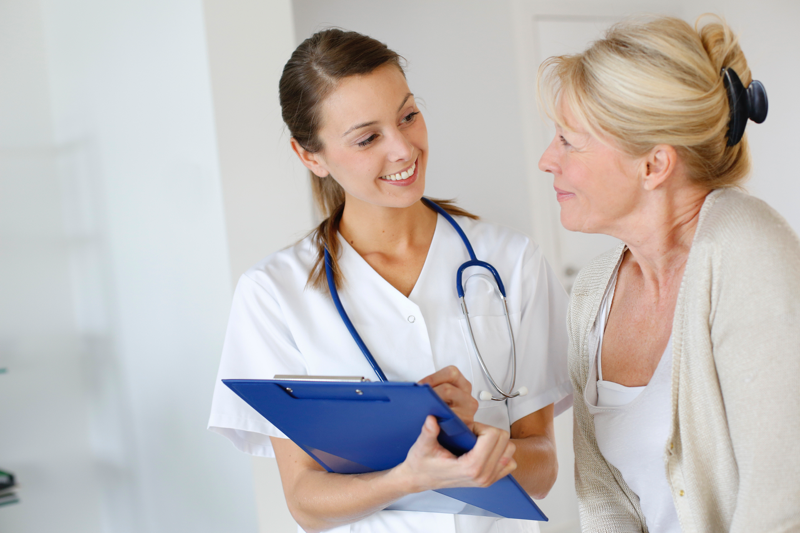 A nurse consulting patient about their endocrine disorder
