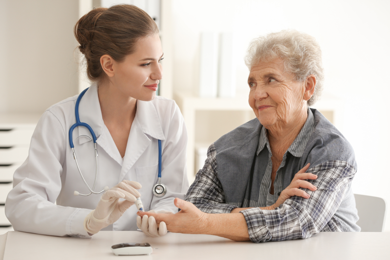 Nurse managing an elderly diabetes patient
