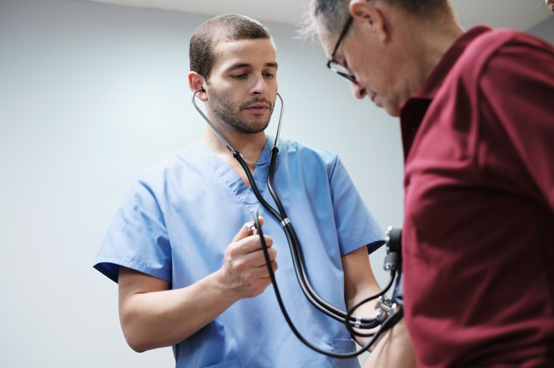 Nurse assessing a patient with cardiovascular problems