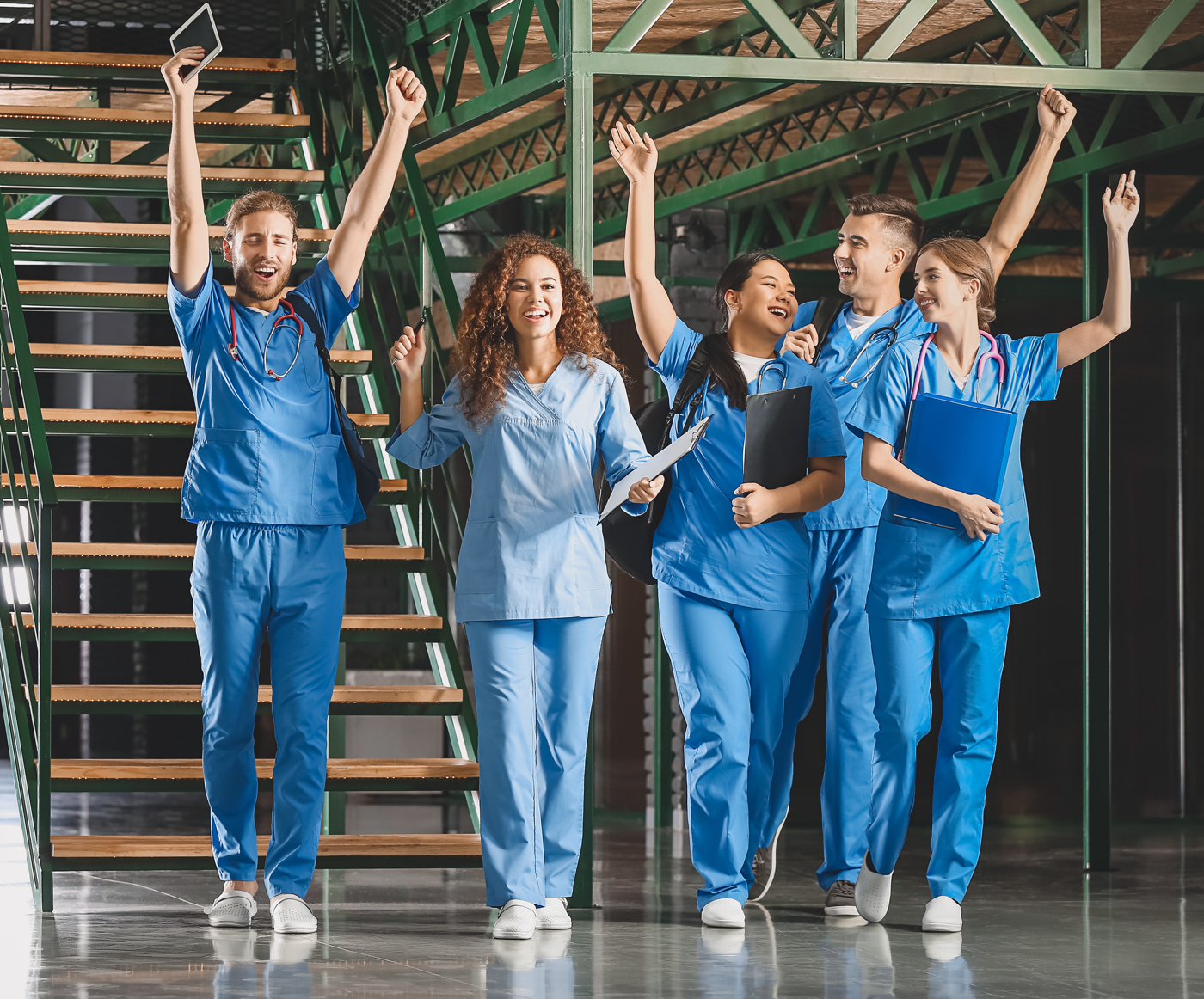 NCLEX pass rate: Group of nurses cheer while walking together