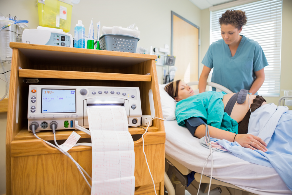 Nurse taking care of a pregnant patient