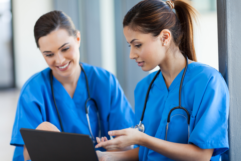 Two nurses looking at the camera